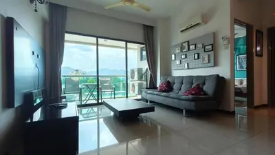 a living room with a couch and a table at Kinta Riverfront Apartment Riverview Apartment in Ipoh