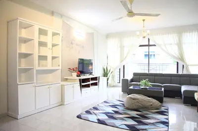 a living room with a couch and a tv at Isabella Villa George Town Penang in George Town