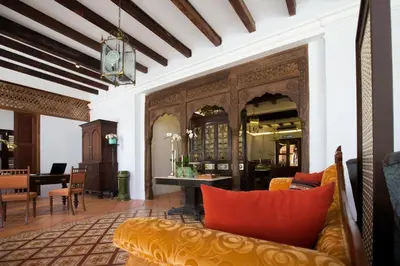 a living room with a couch and a table at Jawi Peranakan Mansion in George Town
