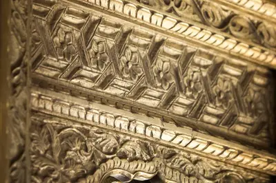a wooden door with a carving on it at Jawi Peranakan Mansion in George Town