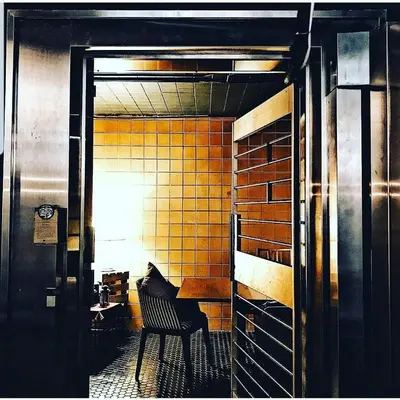 a kitchen with a table and a chair in a room at Kim Haus Loft in George Town