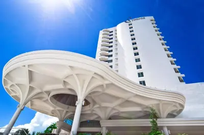 a building in front of a tall white building at Flamingo Hotel by the Beach, Penang in George Town