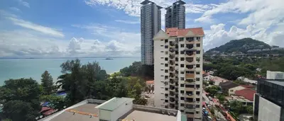 a view of a city with buildings and the water at Leisure Cove Hotel and Apartments in George Town