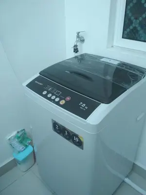 a microwave oven sitting on top of a counter at The Majestic condo Ipoh in Ipoh