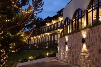 a building lit up at night with christmas lights at Cameron Highlands Resort - Small Luxury Hotels of the World in Cameron Highlands