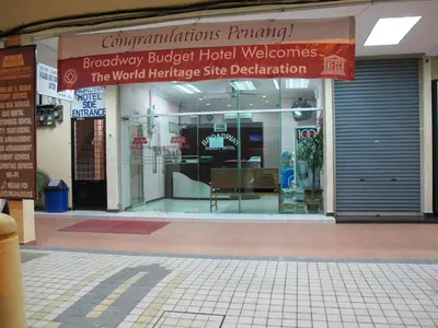 a store front of a building with a sign at Broadway Budget Hotel in George Town