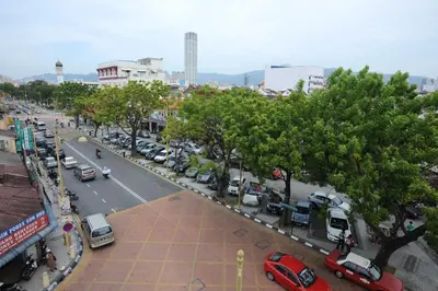 a city street with a lot of cars parked at Broadway Budget Hotel in George Town