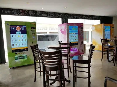 a restaurant with tables and chairs in a room at Garden Inn, Penang in George Town