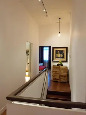 a hallway with a staircase in a house with a room at MY CHINAMAN'S HOME II in George Town