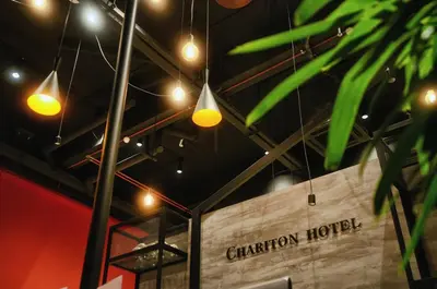 a room with lights hanging from the ceiling at Chariton Hotel Alma in Bukit Mertajam