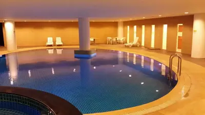 a large swimming pool in a hotel room at 118 Suite in George Town