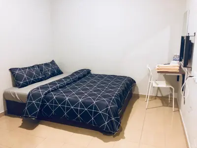 a bedroom with a blue bed and a desk at Lunas Bliss in Lunas