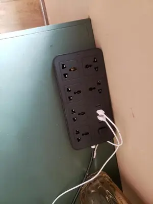 an electrical outlet on the corner of a wall at The Mons inside Tower Regency Hotel and Apartments in Ipoh