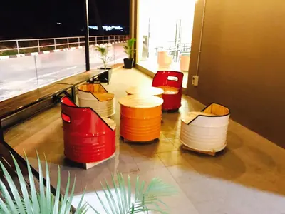 a room with four trash cans in a building at Hotel Nelayan in Pangkor