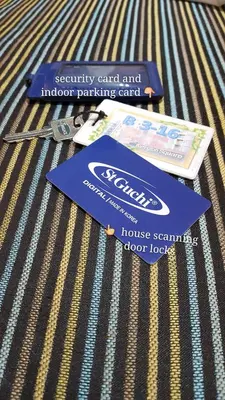 a couple of cards sitting on top of a bed at Feel Homestay in Cameron Highlands