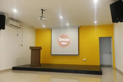 a stage with a sign and a podium in a room at Brezza Hotel Sitiawan in Sitiawan