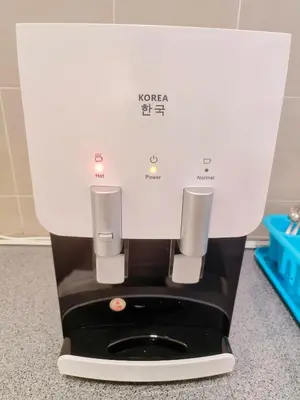 a white coffee machine sitting on top of a counter at MY SWEETHUB HOMESTAY @ CAMERON HIGHLANDS in Cameron Highlands