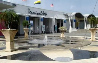 a fountain in a courtyard in front of a building at Lumut Waterfront Apartment 62 in Lumut