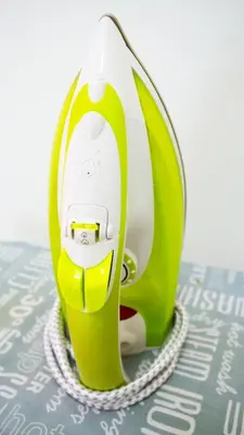 a small green and white appliance sitting on a table at Ipoh Meru Animation Homestay by Grab A Stay in Ipoh