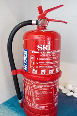 a red fire hydrant with a hose on top at Ipoh Meru Animation Homestay by Grab A Stay in Ipoh