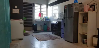 a kitchen with a refrigerator and a stove at Fahaz Kamunting Taiping in Taiping