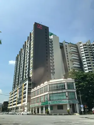 a tall building on a city street with a building at Ipoh City Center Stardorm Ipoh Homestay in Ipoh