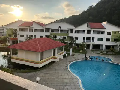 a view of a hotel with a swimming pool at Walking Distance To The Beach, Pangkor in Pangkor