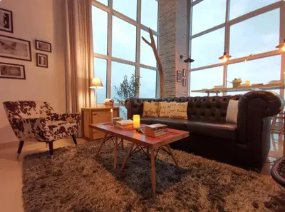 a living room with a couch and a coffee table at Maritime Suites Holiday Rental in George Town