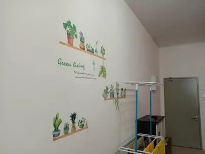 a room with potted plants on the wall at Astana Barrington Square Goldenhills Pasar Malam Cameron Highlands in Cameron Highlands