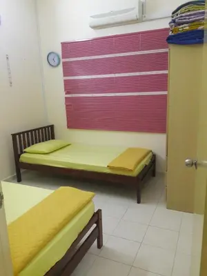 a hospital room with two beds and a window at Jeffrey Homestay B @ Lost World of Tambun in Ipoh