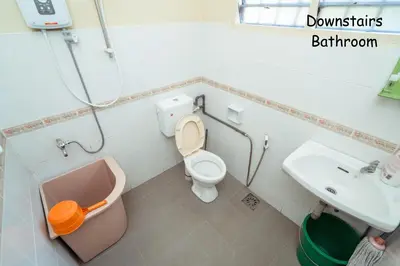 a bathroom with a toilet and a sink at GLYSM Tambun Stay in Ipoh
