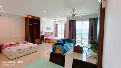 a hotel room with a bedroom and a living room at Mansion One by Hejmo Suites in George Town