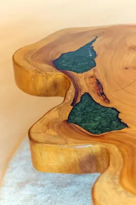 a wooden coffee table with arified wood top at Sunrise Gurney in George Town