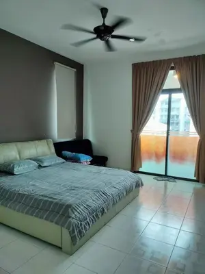 a bedroom with a bed and a ceiling fan at Woon Homestay in Balik Pulau