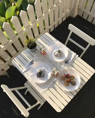 two plates of food sitting on a table on a porch at Baling Mountain Garden Village in Baling