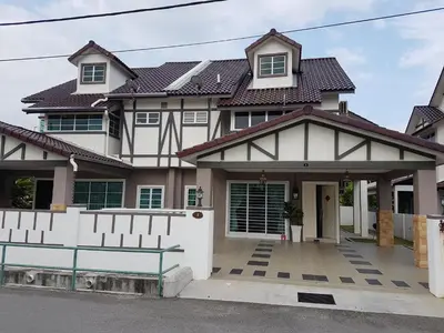 a house with a white fence in front of it at Sitiawan Homestay Entire Semi D house in Sitiawan