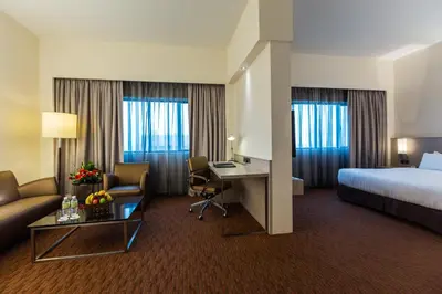 a hotel room with a bed and a desk at Sunway Hotel Seberang Jaya in Perai