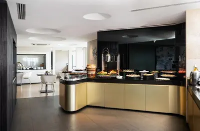 a kitchen with a counter with food on it at G Hotel Gurney in George Town