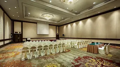 a conference room with rows of chairs and a stage at Berjaya Penang Hotel in George Town