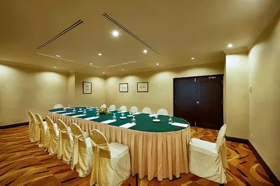 a conference room with a large table and chairs at Berjaya Penang Hotel in George Town