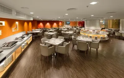 a dining room with tables and chairs in a restaurant at Sunway Hotel Georgetown Penang in George Town