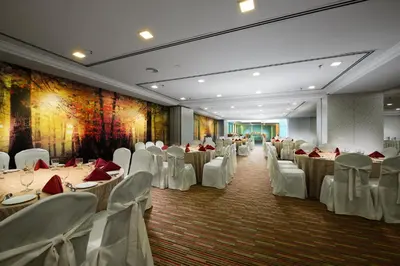 a banquet hall with white tables and white chairs at Sunway Hotel Georgetown Penang in George Town