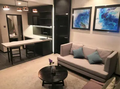 a living room with a couch and a table at Vangohh Eminent Hotel & Spa in Bukit Mertajam