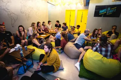 a group of people sitting in a room with bean bags at Traveller Bunker Hostel in Cameron Highlands