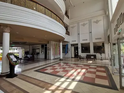 an empty mall with a checkerboard floor in a building at Hotel Seri Malaysia Kulim in Kulim