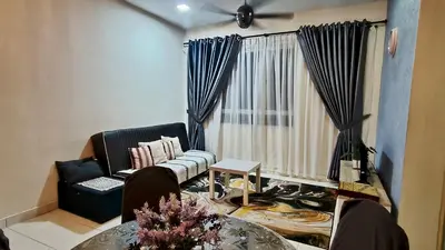 a living room with a couch and a table at Leezahomestay in Bayan Lepas