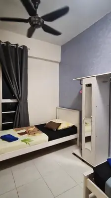 a bedroom with a bed and a ceiling fan at Leezahomestay in Bayan Lepas