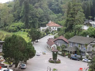 a town with a clock tower in the middle of a street at FH Comfy Home in Bukit Fraser