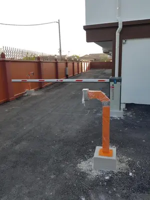an orange object in a parking lot next to a building at Little Kampung Studio in Teluk Intan