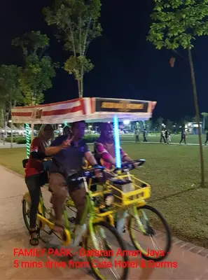 a group of people riding a bike with at Cute Hotel & Dorms Ipoh in Ipoh